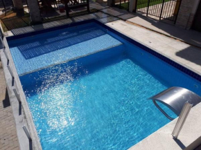 Flat aconchegante a uma quadra da praia